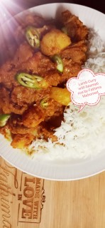 Lamb Curry With Soft Potatoes Paired With White Basmati Rice