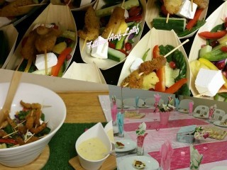 Skewered Chicken Set On A Salad Served In Bamboo Boats With Creamy Dressing