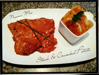 Minute Steak Served With Crumbed Potatoe Slices