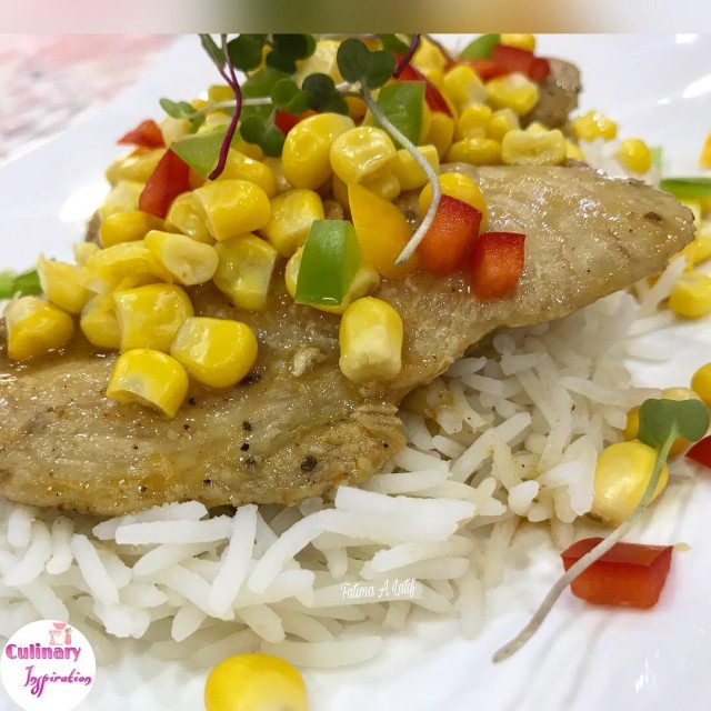 Lemony Chicken Fillets Served On A Bed Of Rice