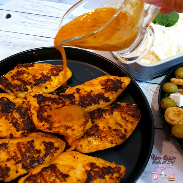 Sriracha Saucy Fillets Served With Potato Salad And Greek Salad