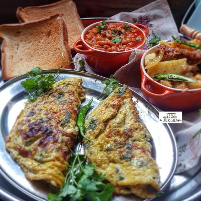 Green Masala Omelet And Spicy Sausage And Potato Fry