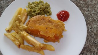 British Style Fish And Chips With Mushy Peas And Curry Sauce