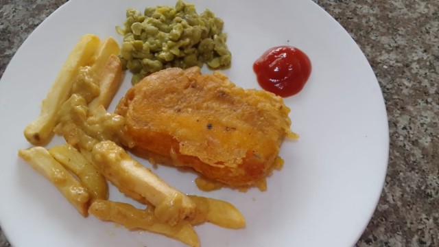 British Style Fish And Chips With Mushy Peas And Curry Sauce