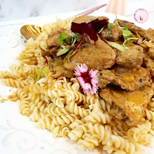 Chilli Pepper Sauce Steak Served On A Bed Of Pasta